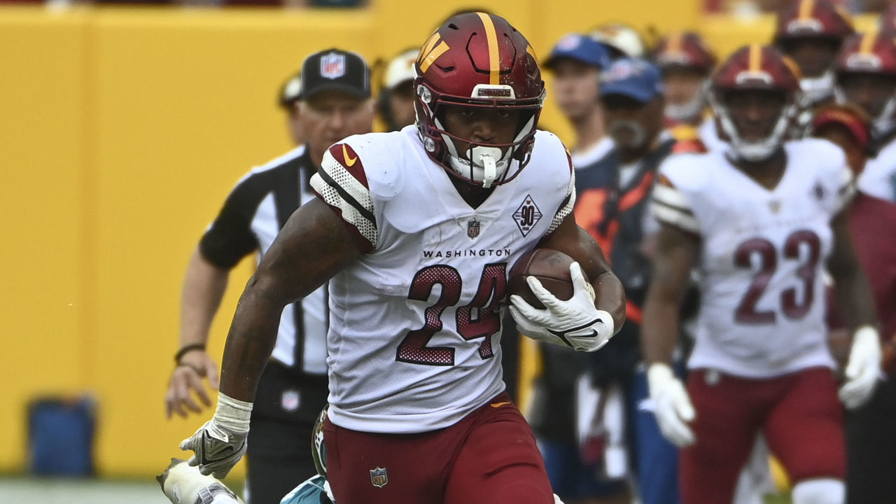 Washington Commanders running back Antonio Gibson is tackled by