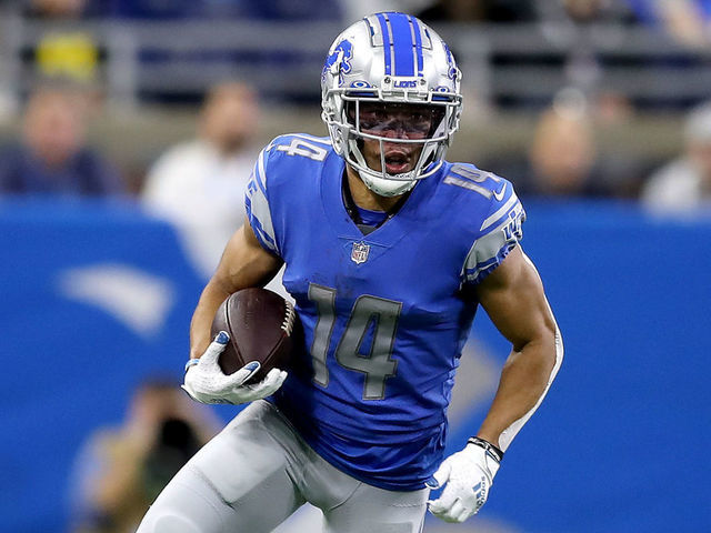 DETROIT, MICHIGAN - DECEMBER 19: Amon-Ra St. Brown #14 of the Detroit Lions runs with the ball against against the Arizona Cardinals in the first half at Ford Field on December 19, 2021 in Detroit, Michigan.