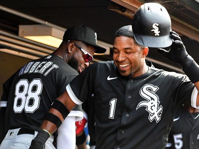 Chicago White Sox's Elvis Andrus, left, puts on the home run