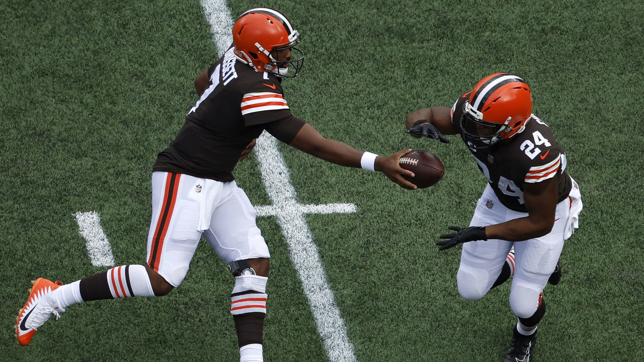 CHARLOTTE, NORTH CAROLINA - SEPTEMBER 11: Jacoby Brissett #7 of the Cleveland Browns hands off to Nick Chubb #24 during the first quarter of their NFL game against the Carolina Panthers at Bank of America Stadium on September 11, 2022 in Charlotte, North Carolina.