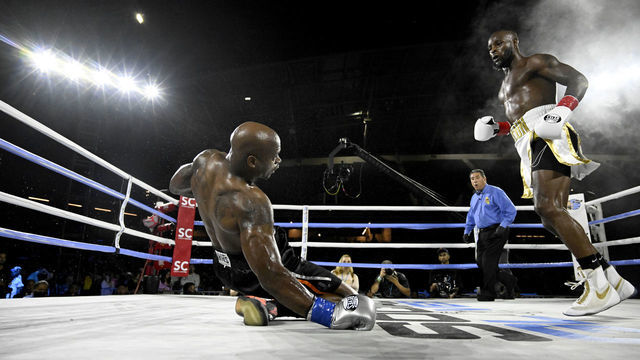 LOS ANGELES, CA - SEPTEMBER 10: LeVeon Bell, white trunks, knocks out Adrian Peterson in the fifth round at Banc of California Stadium on September 10, 2022 in Los Angeles, California.