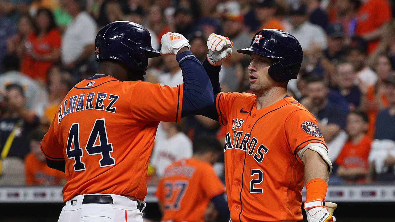 HOUSTON, TEXAS - SEPTEMBER 16: Yordan Alvarez #44 of the Houston Astros receives a high five from Alex Bregman #2 after hitting a home run in first inning against the Oakland Athletics at Minute Maid Park on September 16, 2022 in Houston, Texas.