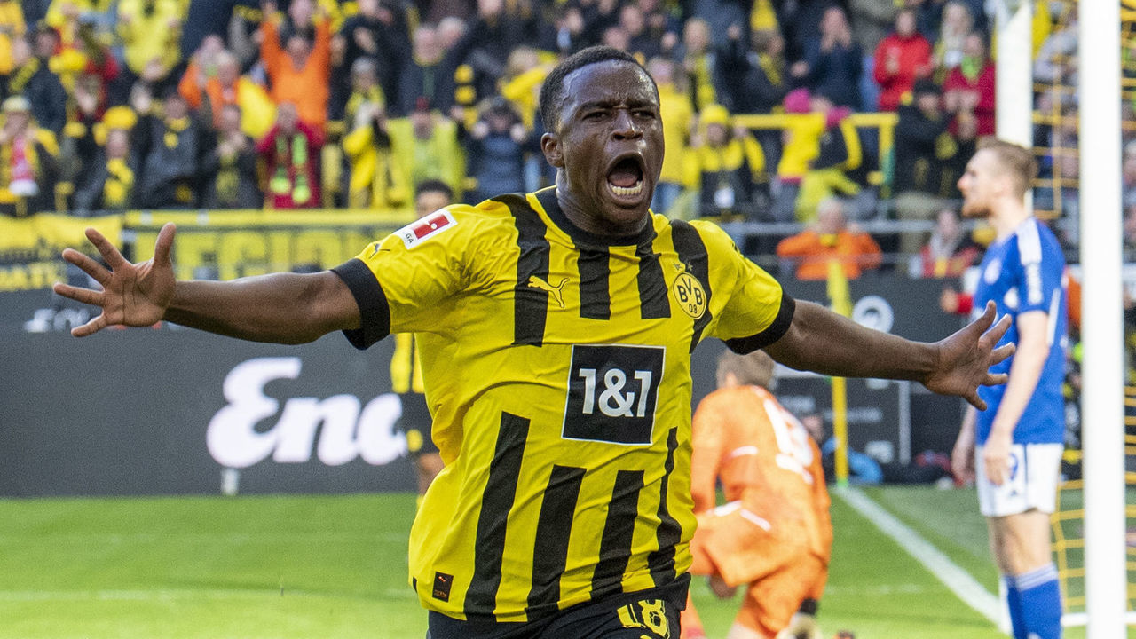 17 September 2022, North Rhine-Westphalia, Dortmund: Soccer: Bundesliga, Borussia Dortmund - FC Schalke 04, Matchday 7, Signal-Iduna Park: Dortmund's Youssoufa Moukoko celebrates after his goal to make it 1:0. Photo: David Inderlied/dpa - IMPORTANT NOTE: In accordance with the requirements of the DFL Deutsche Fußball Liga and the DFB Deutscher Fußball-Bund, it is prohibited to use or have used photographs taken in the stadium and/or of the match in the form of sequence pictures and/or video-like photo series.
