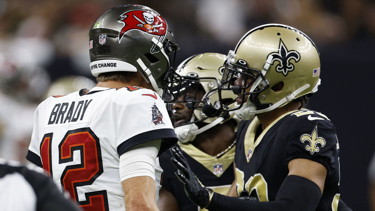 NEW ORLEANS, LOUISIANA - SEPTEMBER 18: Tom Brady #12 of the Tampa Bay Buccaneers and Marshon Lattimore #23 of the New Orleans Saints argue during the fourth quarter of the game at Caesars Superdome on September 18, 2022 in New Orleans, Louisiana.