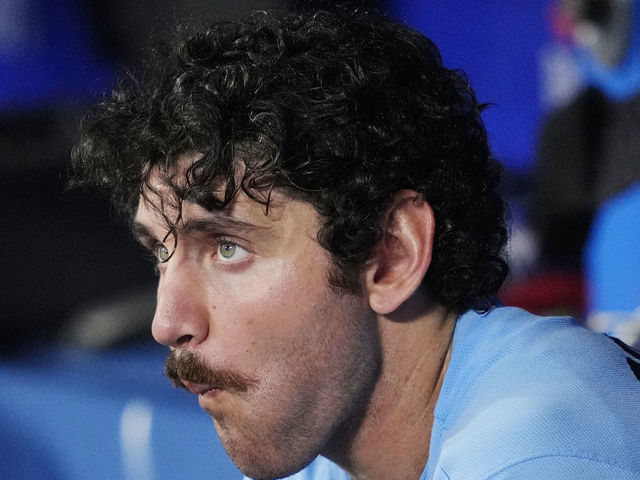 Jordan Romano of the Toronto Blue Jays walks back to the dugout