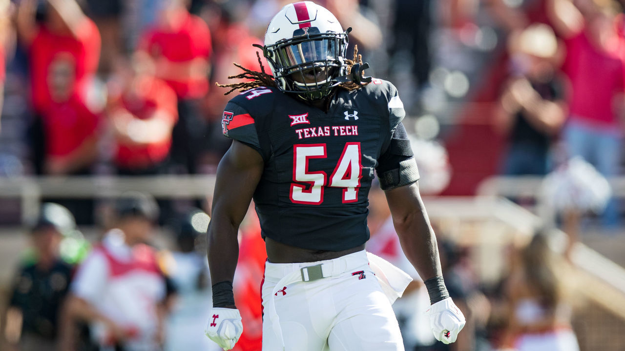 LUBBOCK, TEXAS - OCTOBER 23: Linebacker Bryce Ramirez #54 of the Texas Tech Red Raiders celebrates after the Red Raiders recovered a fumble during the first half of the college football game against the Kansas State Wildcats at Jones AT&T Stadium on October 23, 2021 in Lubbock, Texas.