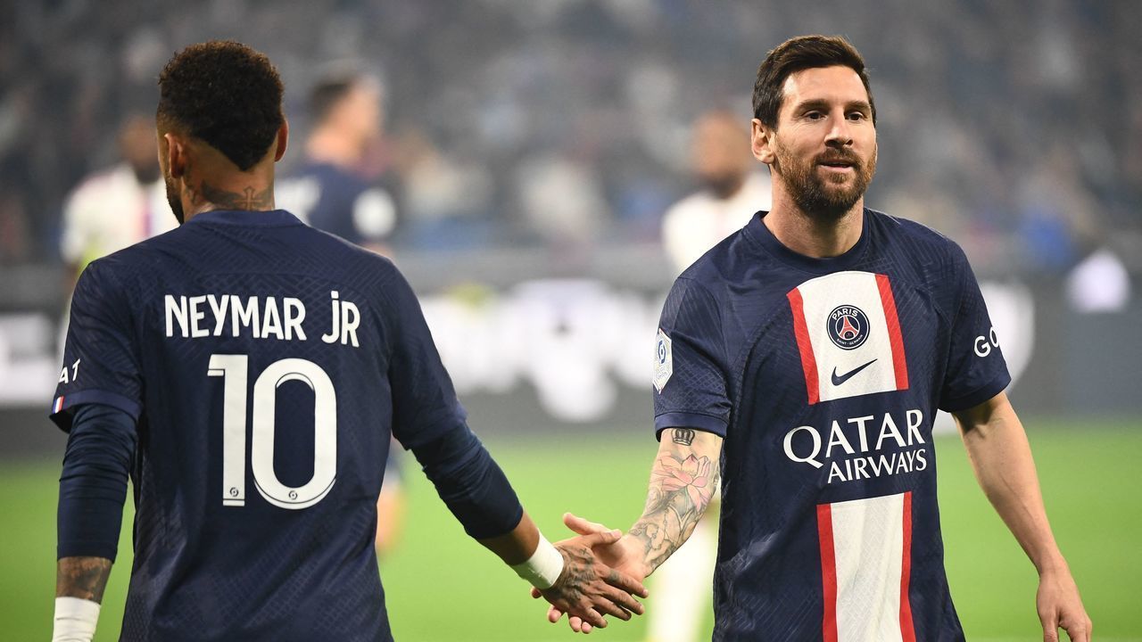 Paris Saint-Germain's Argentine forward Lionel Messi (R) is congratulated by Paris Saint-Germain's Brazilian forward Neymar after scoring a goal during the French L1 football match between Olympique Lyonnais (OL) and Paris Saint-Germain (PSG) at The Groupama Stadium in Decines-Charpieu, central-eastern France, on September 18, 2022.