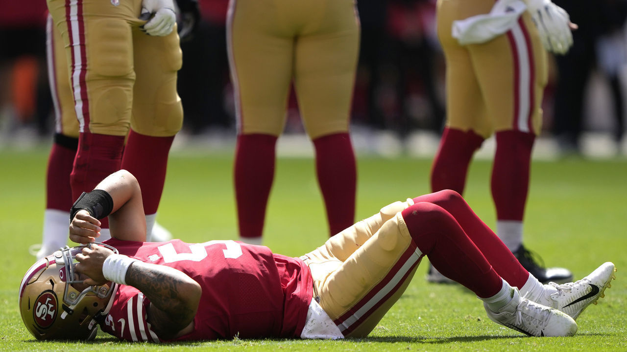 SANTA CLARA, CALIFORNIA - SEPTEMBER 18: Trey Lance #5 of the San Francisco 49ers reacts after an apparent injury following a play against the Seattle Seahawks at Levi's Stadium on September 18, 2022 in Santa Clara, California.