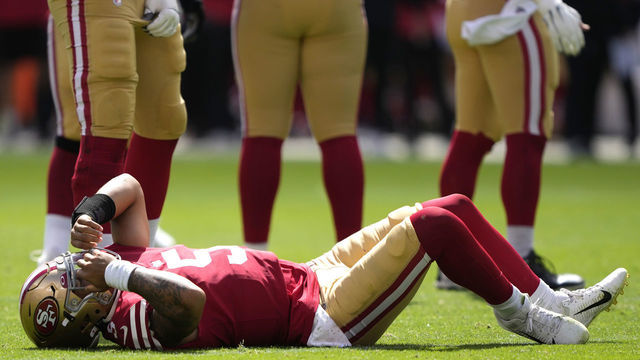 SANTA CLARA, CALIFORNIA - SEPTEMBER 18: Trey Lance #5 of the San Francisco 49ers reacts after an apparent injury following a play against the Seattle Seahawks at Levi's Stadium on September 18, 2022 in Santa Clara, California.