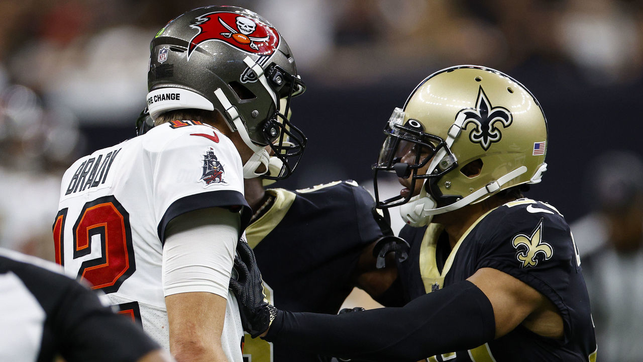 NEW ORLEANS, LOUISIANA - SEPTEMBER 18: Tom Brady #12 of the Tampa Bay Buccaneers and Marshon Lattimore #23 of the New Orleans Saints argue during the fourth quarter of the game at Caesars Superdome on September 18, 2022 in New Orleans, Louisiana.