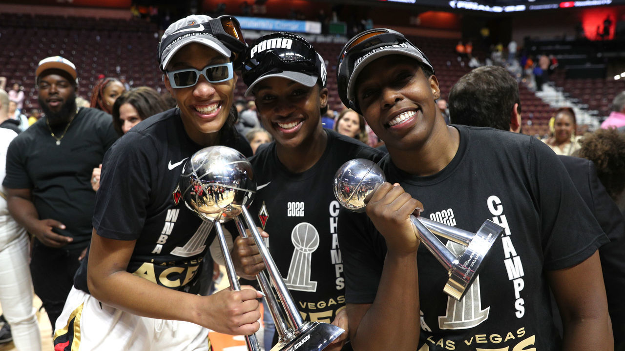 UNCASVILLE, CT - SEPTEMBER 18: A'ja Wilson #22, Jackie Young #0 and Chelsea Gray #12 of the Las Vegas Aces pose with the 2022 WNBA Championship after Game 4 of the 2022 WNBA Finals on September 18, 2022 at Mohegan Sun Arena in Uncasville, Connecticut. NOTE TO USER: User expressly acknowledges and agrees that, by downloading and/or using this Photograph, user is consenting to the terms and conditions of the Getty Images License Agreement. Mandatory Copyright Notice: Copyright 2022 NBAE