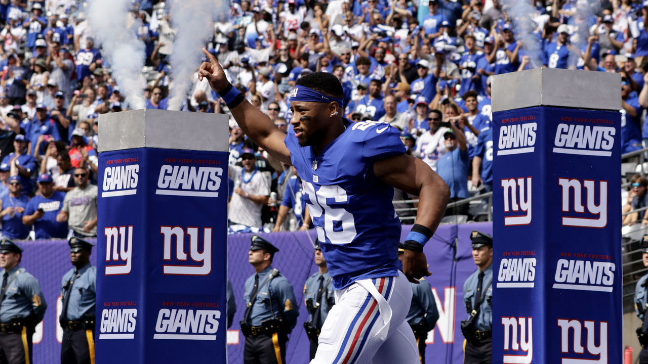 EAST RUTHERFORD, NJ - SEPTEMBER 18: Saquon Barkley #26 of the New York Giants is introduced before a game against the Carolina Panthers at MetLife Stadium on September 18, 2022 in East Rutherford, New Jersey.