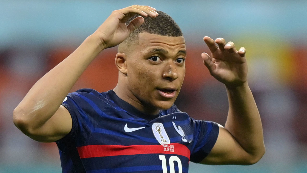 TOPSHOT - France's forward Kylian Mbappe reacts after missing a penalty in the penalty shootout during the UEFA EURO 2020 round of 16 football match between France and Switzerland at the National Arena in Bucharest on June 28, 2021.