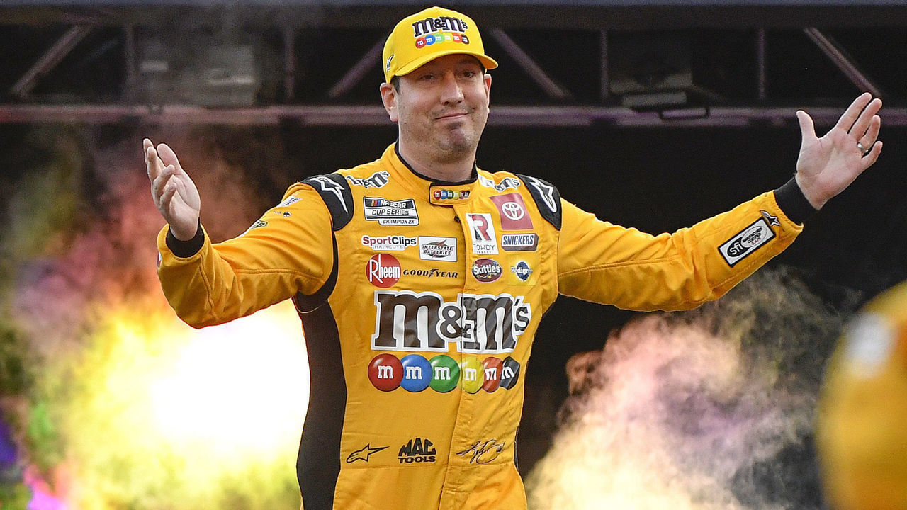 BRISTOL, TENNESSEE - SEPTEMBER 17: Kyle Busch, driver of the #18 M&M's Toyota, walks onstage during driver intros prior to the NASCAR Cup Series Bass Pro Shops Night Race at Bristol Motor Speedway on September 17, 2022 in Bristol, Tennessee.
