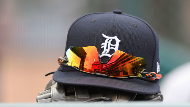 DETROIT, MI - APRIL 09: A detailed view of a Detroit Tigers baseball hat and sunglasses during the game against the Chicago White Sox at Comerica Park on April 9, 2022 in Detroit, Michigan. The White Sox defeated the Tigers 5-2.