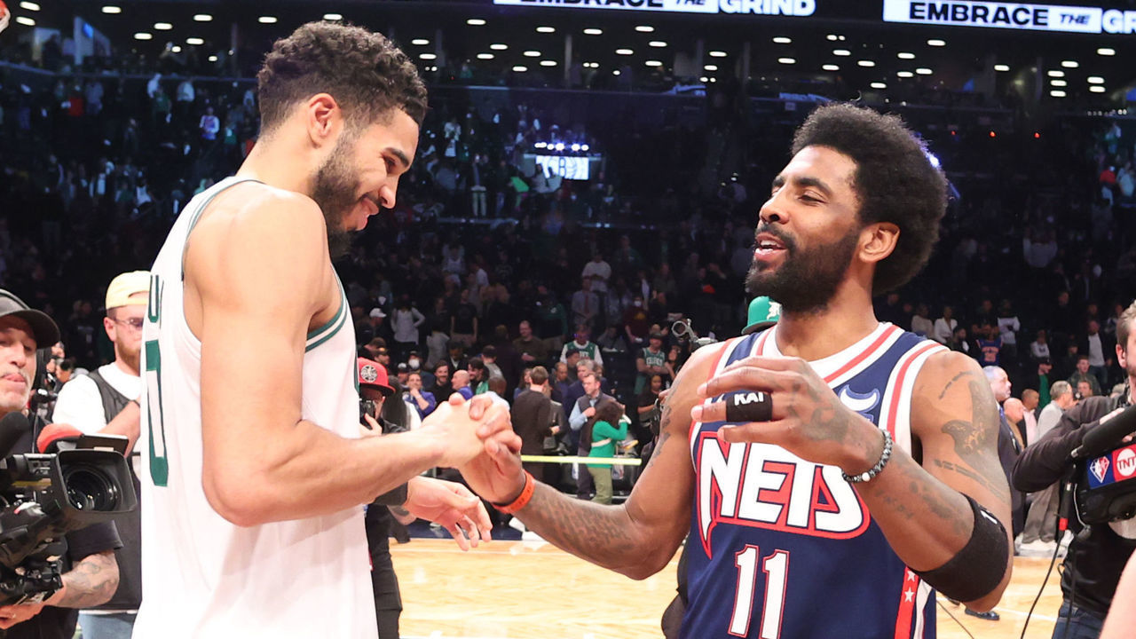 BROOKLYN, NY - APRIL 25: Jayson Tatum #0 of the Boston Celtics talks to Kyrie Irving #11 of the Brooklyn Nets after Round 1 Game 4 of the 2022 NBA Playoffs on April 25, 2022 at Barclays Center in Brooklyn, New York. Mandatory Copyright Notice: Copyright 2022 NBAE