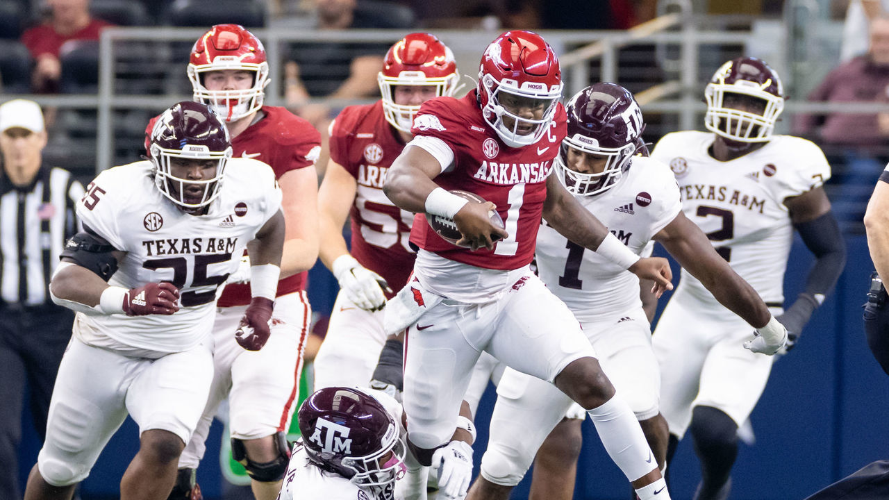 ARLINGTON, TX - SEPTEMBER 25: Arkansas Razorbacks quarterback KJ Jefferson (#1) breaks away from Texas A&M Aggies defensive back Leon ONeal Jr. (#9) and runs up field during the Southwest Classic college football game between the Texas A&M Aggies and Arkansas Razorbacks on September 25, 2021 at AT&T Stadium in Arlington, TX.