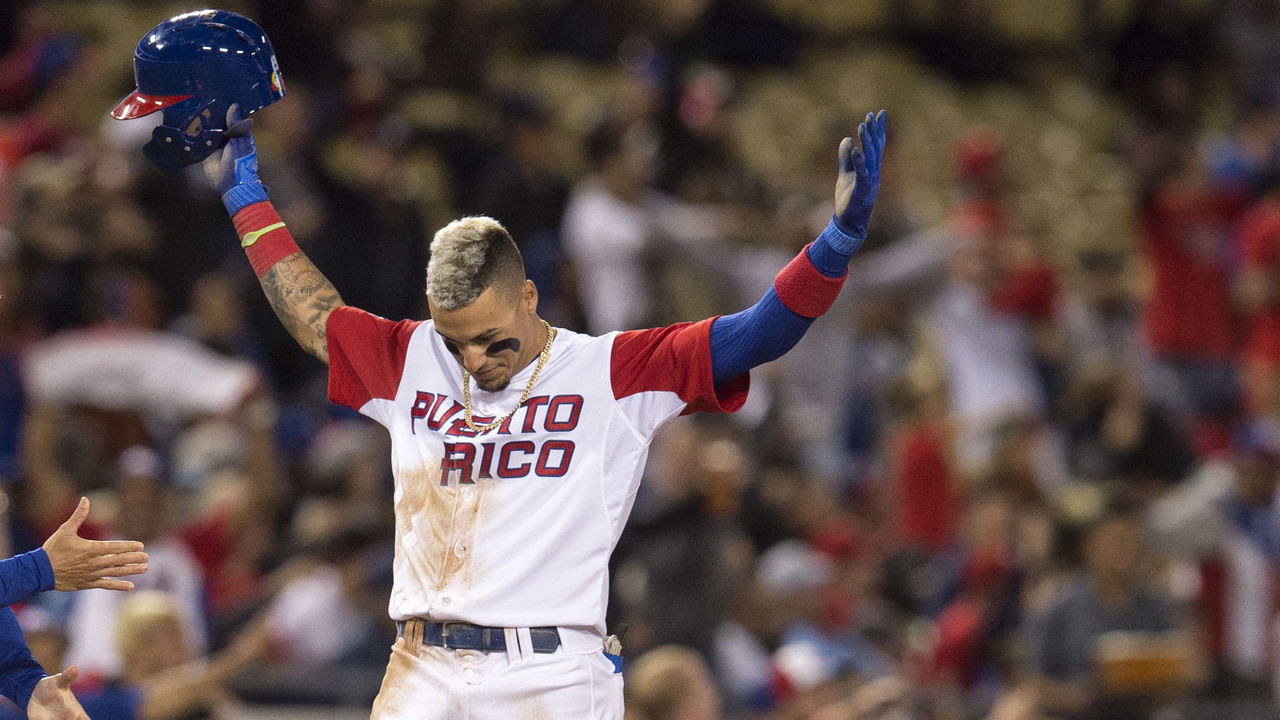 Los Angeles, CA - March 20:Puerto Ricos Javier Baez #9 reacts after stealing third base in the 4th inning during their World Baseball Classic game against the Netherlands at Dodger Stadium in Los Angeles, Monday, March 20, 2017.