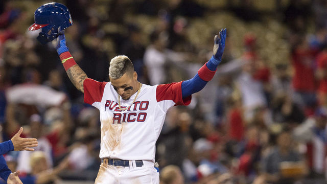 Los Angeles, CA - March 20:Puerto Ricos Javier Baez #9 reacts after stealing third base in the 4th inning during their World Baseball Classic game against the Netherlands at Dodger Stadium in Los Angeles, Monday, March 20, 2017.