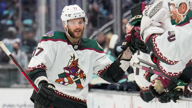 SEATTLE, WASHINGTON - FEBRUARY 09: Alex Galchenyuk #17 of the Arizona Coyotes celebrates his goal at the bench during the third period of a game between the Arizona Coyotes and the Seattle Kraken at Climate Pledge Arena on February 09, 2022 in Seattle, Washington.