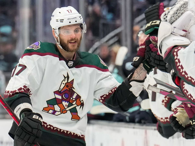 SEATTLE, WASHINGTON - FEBRUARY 09: Alex Galchenyuk #17 of the Arizona Coyotes celebrates his goal at the bench during the third period of a game between the Arizona Coyotes and the Seattle Kraken at Climate Pledge Arena on February 09, 2022 in Seattle, Washington.