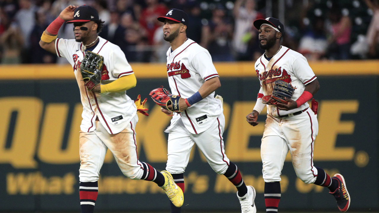 ATLANTA, GA - SEPTEMBER 19: Ronald Acuna Jr. #13 right fielder of the Atlanta Braves with Eddie Rosario #8 left fielder of the Atlanta Braves and Michael Harris ll #23 center fielder of the Atlanta Braves celebrate after the MLB game between the Washington Nationals and the Atlanta Braves on September 19, 2022 at Truist Park in Atlanta, GA.
