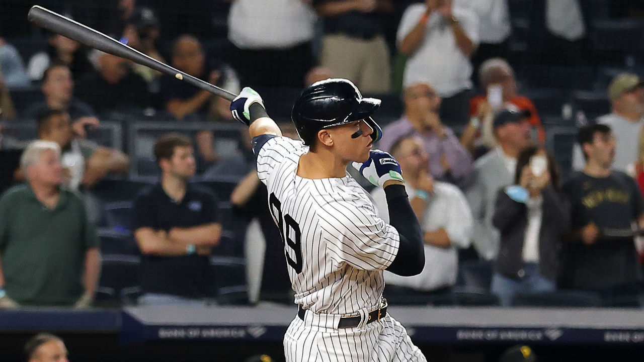 NEW YORK, NEW YORK - SEPTEMBER 20: Aaron Judge #99 of the New York Yankees hits his 60th home run of the season during the 9th inning of the game against the Pittsburgh Pirates at Yankee Stadium on September 20, 2022 in the Bronx borough of New York City.