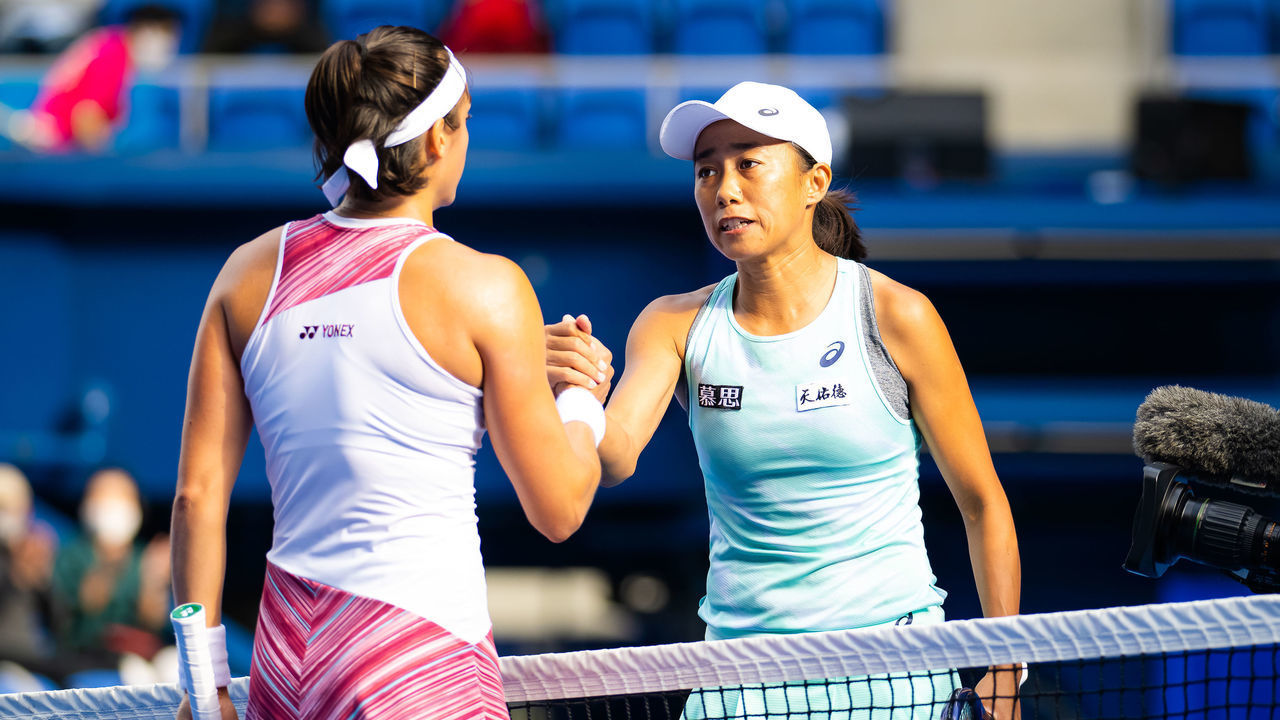 TOKYO, JAPAN - SEPTEMBER 21: Caroline Garcia of France and Shuai Zhang of China shake hands atvthe net after their second round match on Day 3 of the Toray Pan Pacific Open at Ariake Coliseum on September 21, 2022 in Tokyo, Japan