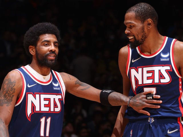 BROOKLYN, NY - APRIL 25: Kyrie Irving #11 talks to Kevin Durant #7 of the Brooklyn Nets during Round 1 Game 4 of the 2022 NBA Playoffs on April 25, 2022 at Barclays Center in Brooklyn, New York. Mandatory Copyright Notice: Copyright 2022 NBAE