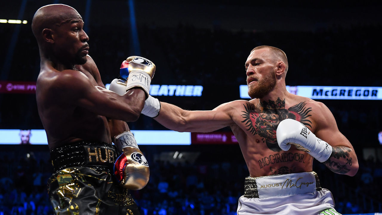 Nevada , United States - 26 August 2017; Conor McGregor, right, and Floyd Mayweather Jr during their super welterweight boxing match at T-Mobile Arena in Las Vegas, USA.