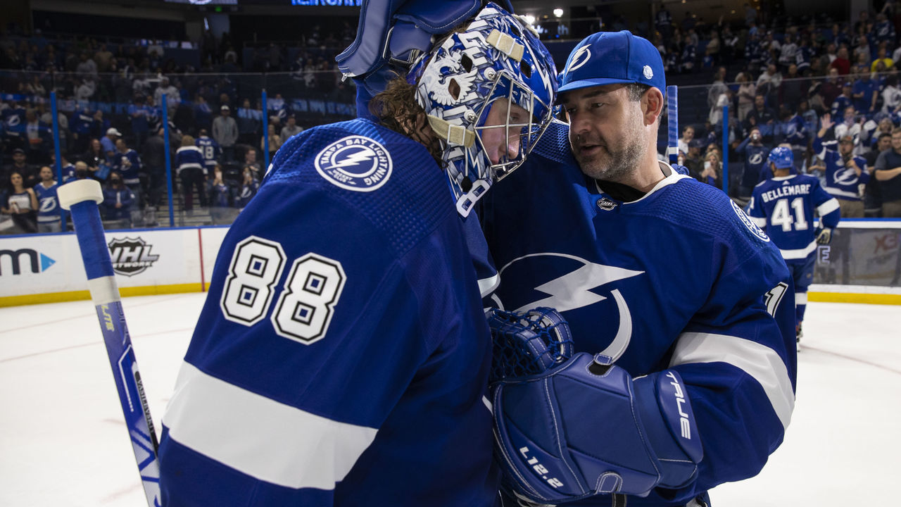TAMPA, FL - MARCH 1: Goalies Andrei Vasilevskiy #88 and Brian Elliott #1 of the Tampa Bay Lightning celebrate the win against the Ottawa Senators at Amalie Arena on March 1, 2022 in Tampa, Florida.