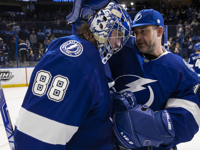 TAMPA, FL - MARCH 1: Goalies Andrei Vasilevskiy #88 and Brian Elliott #1 of the Tampa Bay Lightning celebrate the win against the Ottawa Senators at Amalie Arena on March 1, 2022 in Tampa, Florida.