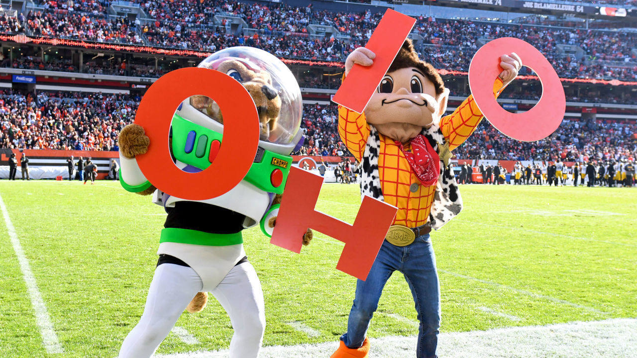 CLEVELAND, OH - OCTOBER 31: Cleveland Browns mascots "Chomps" and "Brownie the Elf" lead the crowd in an "O-H-I-O" chant during the second half against the Pittsburgh Steelers at FirstEnergy Stadium on October 31, 2021 in Cleveland, Ohio.