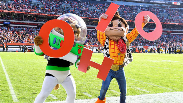 CLEVELAND, OH - OCTOBER 31: Cleveland Browns mascots "Chomps" and "Brownie the Elf" lead the crowd in an "O-H-I-O" chant during the second half against the Pittsburgh Steelers at FirstEnergy Stadium on October 31, 2021 in Cleveland, Ohio.