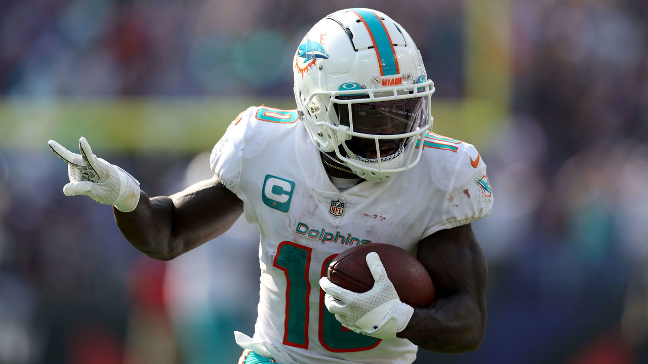 BALTIMORE, MARYLAND - SEPTEMBER 18: Wide receiver Tyreek Hill #10 of the Miami Dolphins celebrates while scoring his second pass touchdown against the Baltimore Ravens at M&T Bank Stadium on September 18, 2022 in Baltimore, Maryland.