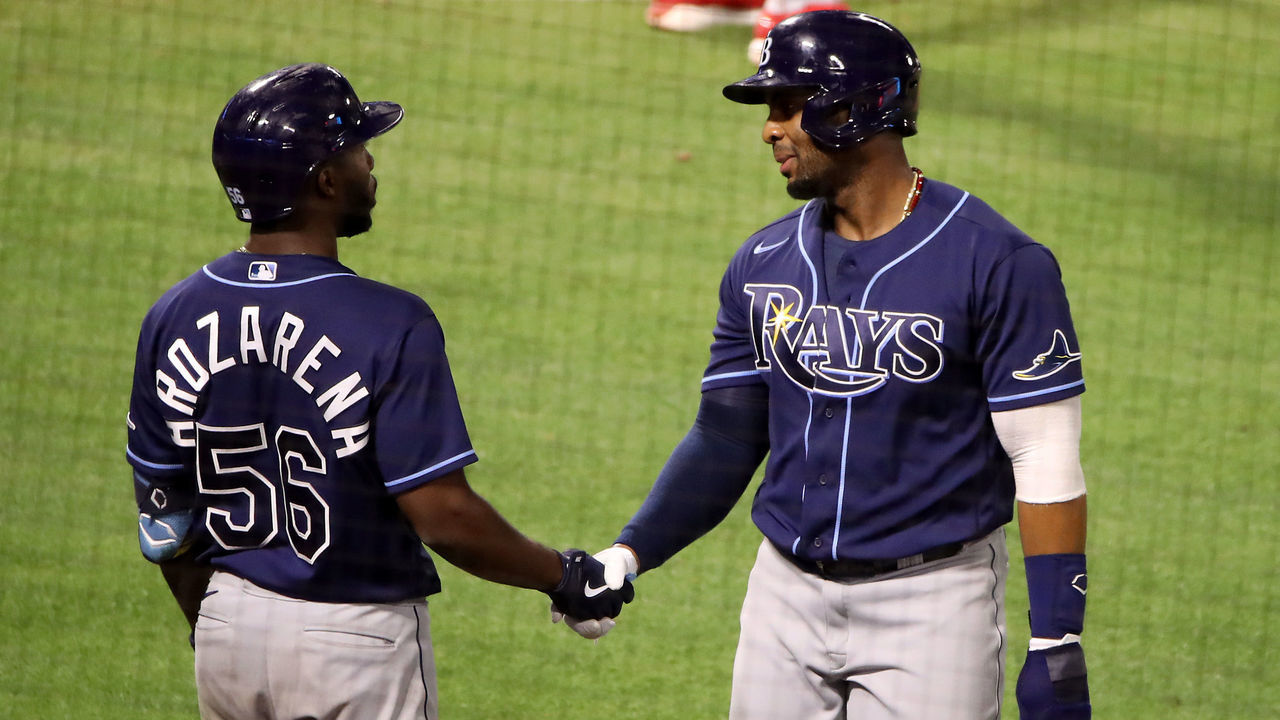 ANAHEIM, CALIFORNIA - MAY 04: Yandy Diaz #2 of the Tampa Bay Rays celebrates a run off a two RBI double from Kiermaier with Randy Arozarena #56 against the Los Angeles Angels during the sixth inning at Angel Stadium of Anaheim on May 04, 2021 in Anaheim, California.