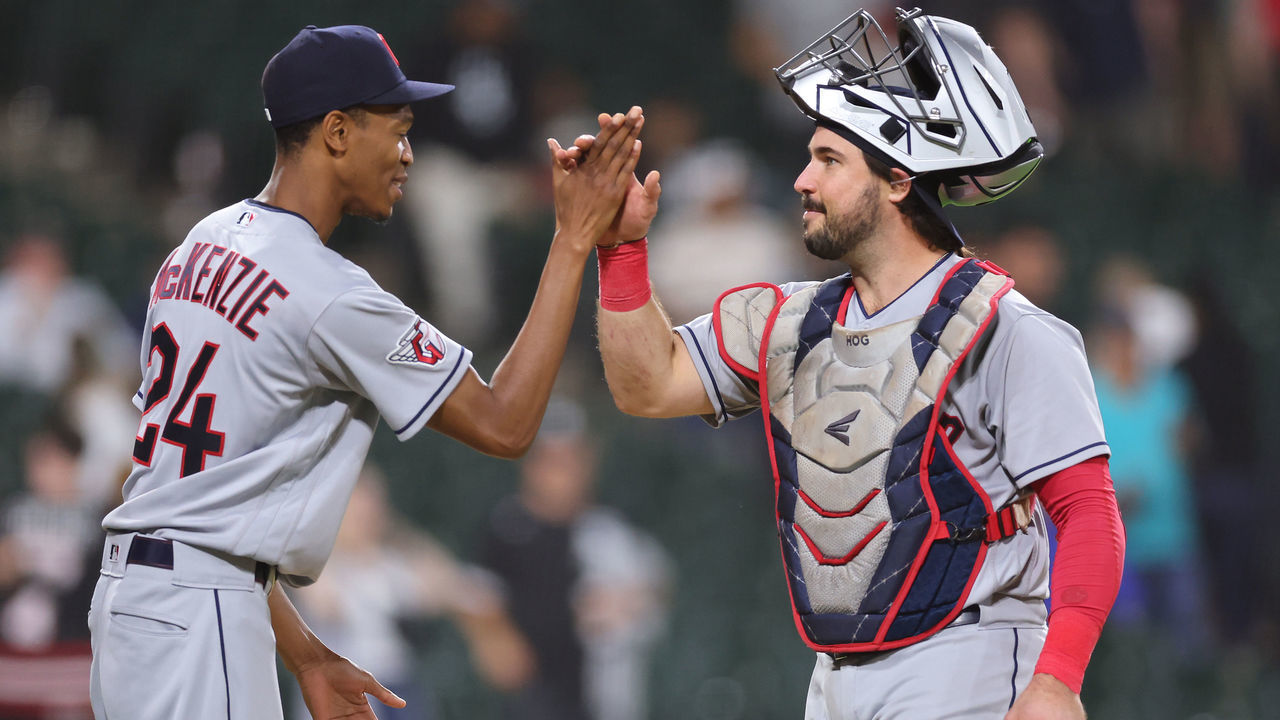 CHICAGO, ILLINOIS - SEPTEMBER 21: Triston McKenzie #24 and Austin Hedges #17 of the Cleveland Guardians celebrate after defeating the Chicago White Sox 8-2 at Guaranteed Rate Field on September 21, 2022 in Chicago, Illinois.