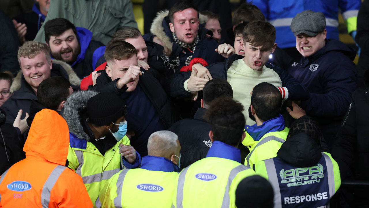 WATFORD, ENGLAND - DECEMBER 01: Chelsea fans fight with stewards after the 2nd goal during the Premier League match between Watford and Chelsea at Vicarage Road on December 1, 2021 in Watford, England.