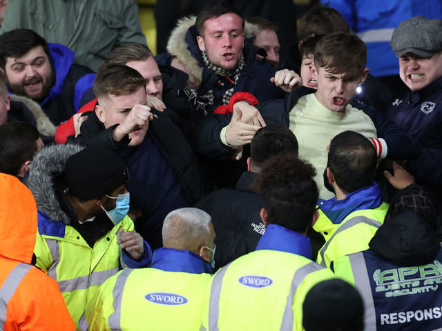 WATFORD, ENGLAND - DECEMBER 01: Chelsea fans fight with stewards after the 2nd goal during the Premier League match between Watford and Chelsea at Vicarage Road on December 1, 2021 in Watford, England.
