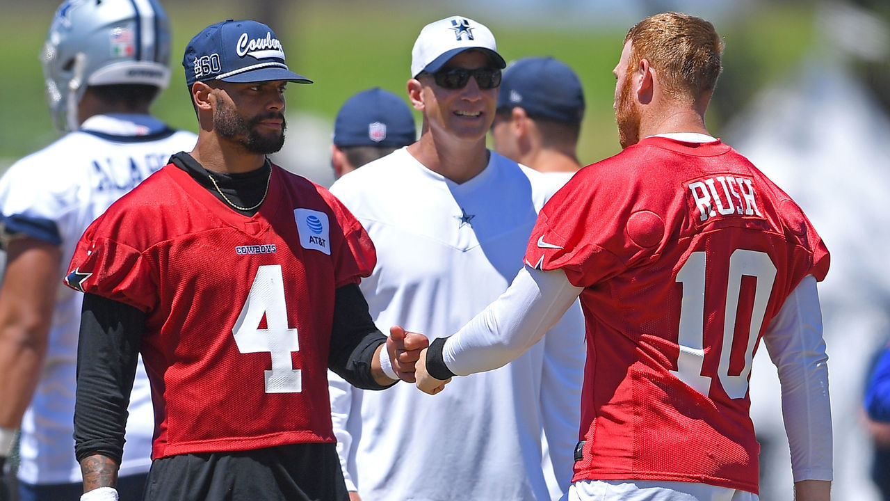 OXNARD, CA - AUGUST 03: Quarterbacks Dak Prescott #4 and Cooper Rush #10 of the Dallas Cowboys talk during training camp at River Ridge Complex on August 3, 2021 in Oxnard, California.