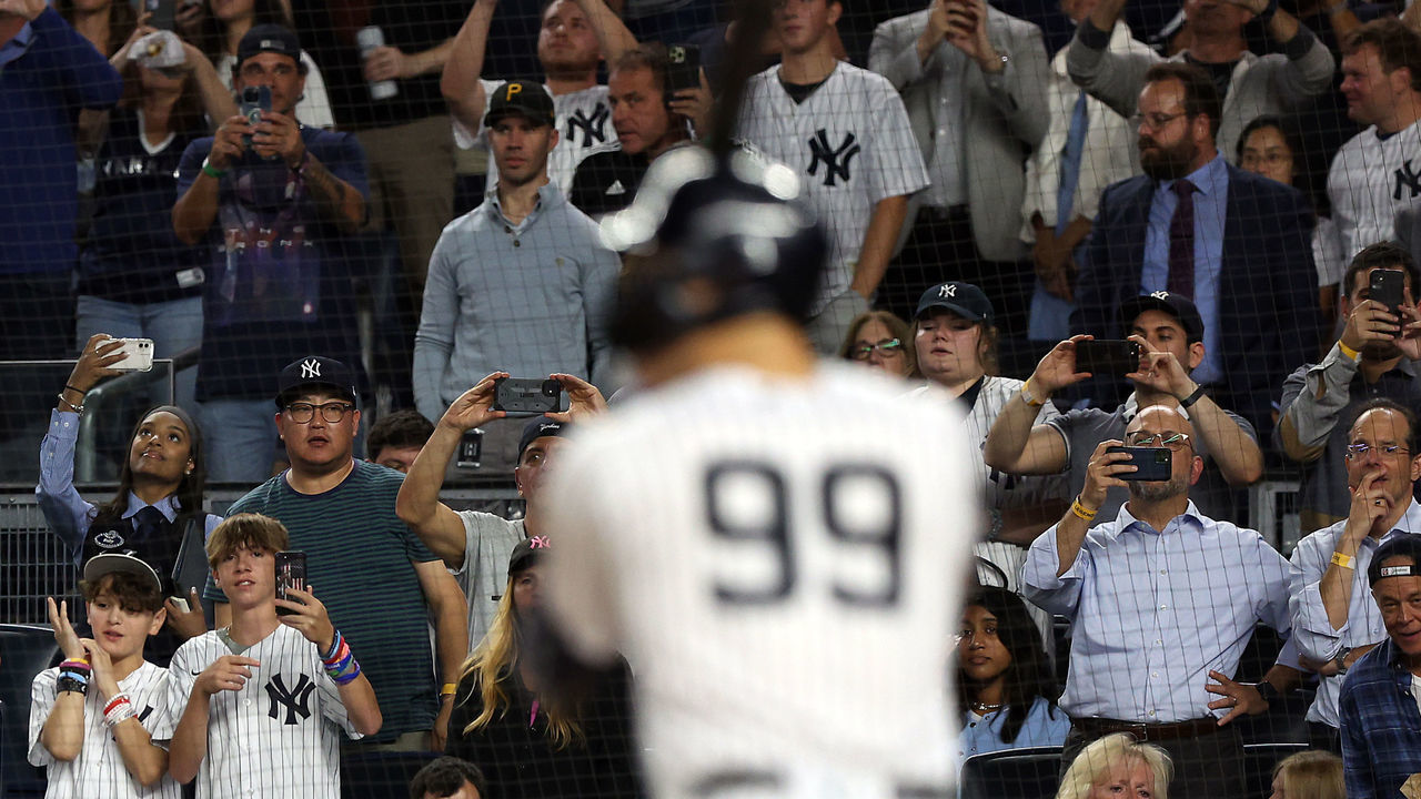 NEW YORK, NEW YORK - SEPTEMBER 21: Fans watch as Aaron Judge #99 of the New York Yankees bats during the 5th inning of the game against the Pittsburgh Pirates at Yankee Stadium on September 21, 2022 in the Bronx borough of New York City.