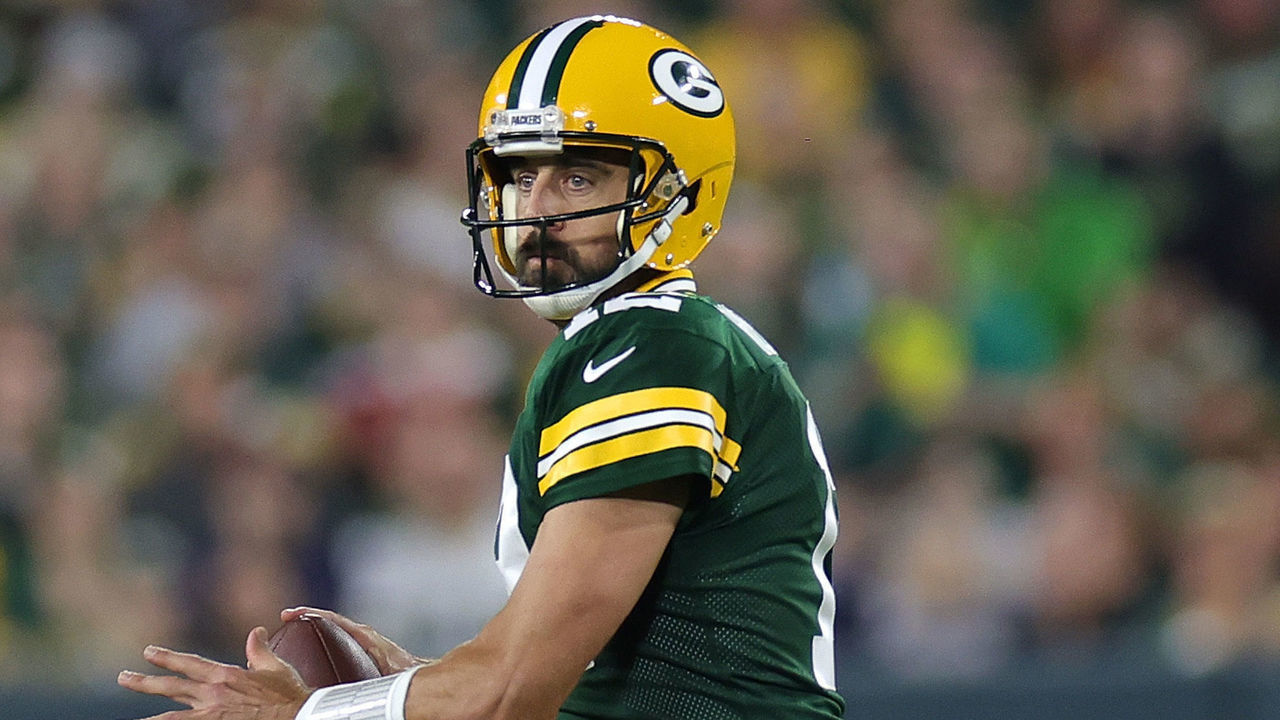 GREEN BAY, WISCONSIN - SEPTEMBER 18: Aaron Rodgers #12 of the Green Bay Packers drops back to pass during a game against the Chicago Bears at Lambeau Field on September 18, 2022 in Green Bay, Wisconsin. The Packers defeated the Bears 27-10.