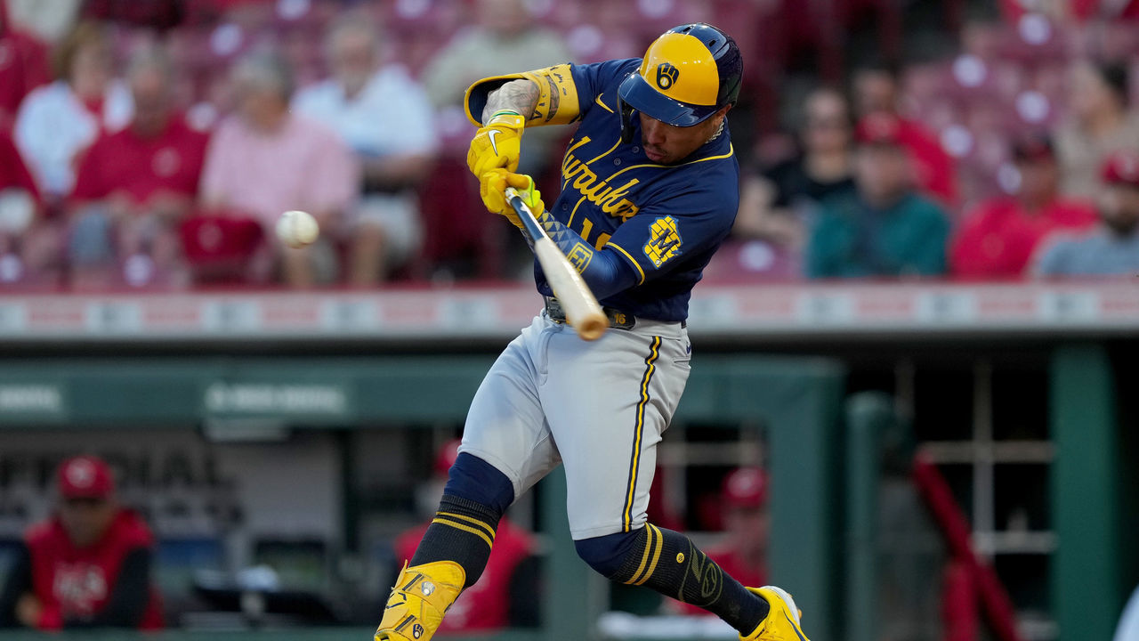 CINCINNATI, OHIO - SEPTEMBER 22: Kolten Wong #16 of the Milwaukee Brewers hits a home run in the second inning against the Cincinnati Reds at Great American Ball Park on September 22, 2022 in Cincinnati, Ohio.