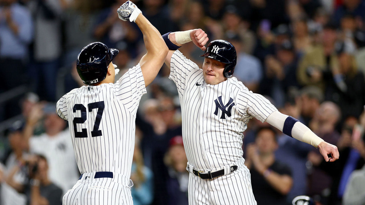 NEW YORK, NEW YORK - SEPTEMBER 22: Giancarlo Stanton #27 and Josh Donaldson #28 of the New York Yankees celebrate after both scored off a two run home run by Stanton in the sixth inning against the Boston Red Sox at Yankee Stadium on September 22, 2022 in the Bronx borough of New York City.