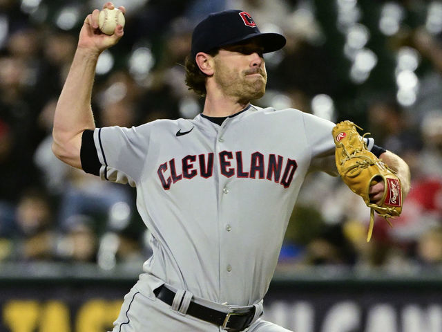 Cleveland Guardians pitcher Shane Bieber (57) pitches the ball