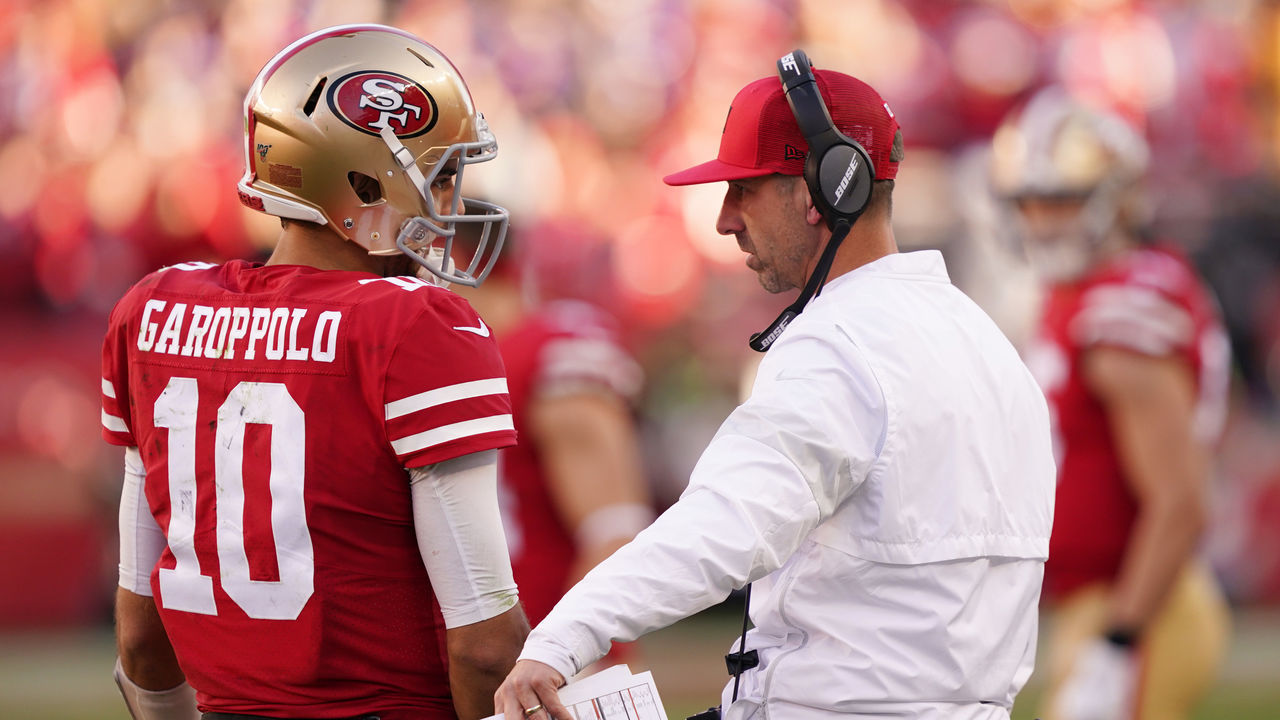 SANTA CLARA, CALIFORNIA - JANUARY 11: Jimmy Garoppolo #10 speaks with head coach Kyle Shanahan of the San Francisco 49ers during the NFC Divisional Round Playoff game against the Minnesota Vikings at Levi's Stadium on January 11, 2020 in Santa Clara, California.