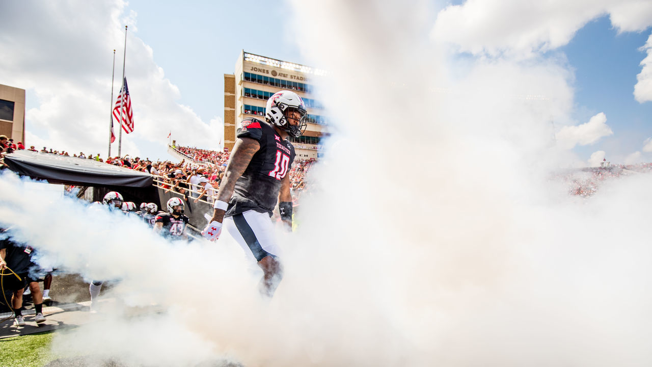 LUBBOCK, TEXAS - SEPTEMBER 10: Defensive back Cam White #10 of the Texas Tech Red Raiders runs onto the field before the game against the Houston Cougars at Jones AT&T Stadium on September 10, 2022 in Lubbock, Texas.