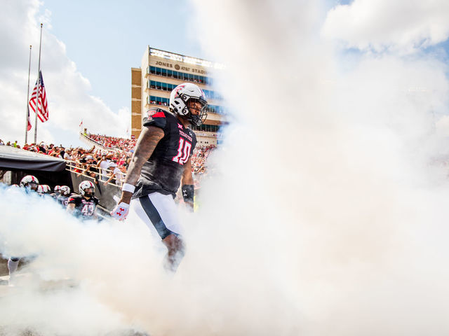 LUBBOCK, TEXAS - SEPTEMBER 10: Defensive back Cam White #10 of the Texas Tech Red Raiders runs onto the field before the game against the Houston Cougars at Jones AT&T Stadium on September 10, 2022 in Lubbock, Texas.