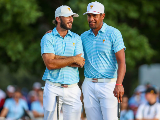 CHARLOTTE, NC - SEPTEMBER 22: U.S. Team Members Tony Finau and Max Homa share a laugh on the 18th green during the first round of the Presidents Cup on Sep 22, 2022, at Quail Hollow Club in Charlotte, NC.