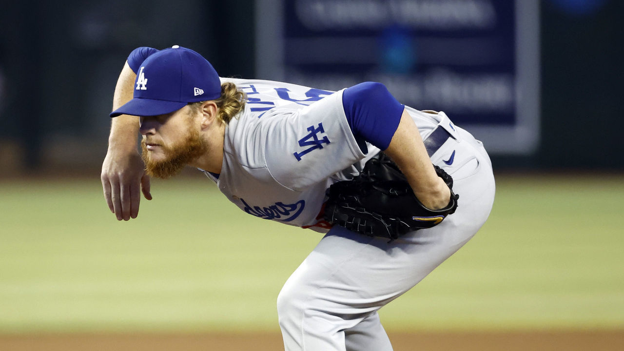PHOENIX, ARIZONA - SEPTEMBER 14: Pitcher Craig Kimbrel #46 of the Los Angeles Dodgers takes the sign in the 10th inning against the Arizona Diamondbacks at Chase Field on September 14, 2022 in Phoenix, Arizona.